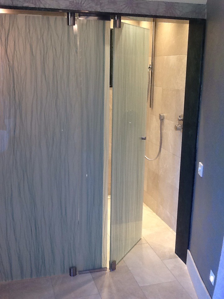 Glass shower panel in bathroom at Salisbury House Lancashire by Daedalian