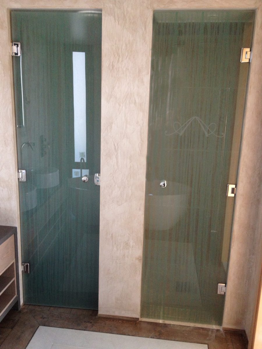 Shower doors made of laminated chiffon, featuring an etched double A logo as requested.
