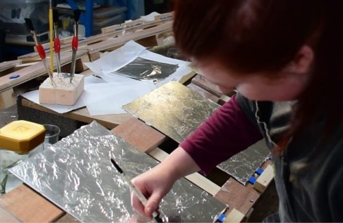 Manufacturing hand-silvered, antique mirror panels.